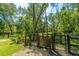 Fenced dog park featuring a secure enclosure and play area with mature trees in a natural setting at 3025 Buckeley Cir, Charleston, SC 29414