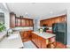 Bright kitchen with hardwood floors, stainless steel appliances, wood cabinets, an island, and a view to another room at 3025 Buckeley Cir, Charleston, SC 29414