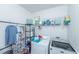 Functional laundry room with washer, dryer, shelving, and storage for household supplies at 3025 Buckeley Cir, Charleston, SC 29414