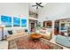 Cozy living room with open floorplan shows fireplace, vaulted ceiling and staircase to second level at 3025 Buckeley Cir, Charleston, SC 29414