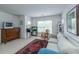 Bright living room featuring a comfortable sofa, rocking chair, and a large window allowing ample natural light at 3025 Buckeley Cir, Charleston, SC 29414