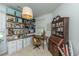 Functional home office with custom shelving, desk area, and natural light at 3025 Buckeley Cir, Charleston, SC 29414