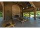 A brick fireplace and rustic picnic tables highlight the community pavilion's inviting interior at 3025 Buckeley Cir, Charleston, SC 29414