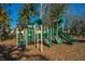 Inviting playground with slides, climbing features, and soft ground cover for to enjoy outdoor activities at 3025 Buckeley Cir, Charleston, SC 29414