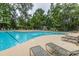 Resort-style pool with fountains, lounge chairs and lush landscaping for outdoor relaxation at 3025 Buckeley Cir, Charleston, SC 29414