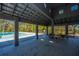 Open pool house with tables and chairs for outdoor dining and relaxation at 3025 Buckeley Cir, Charleston, SC 29414
