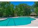 Enjoy the community pool with ample seating, shaded areas, and a large deck surrounded by lush greenery at 3025 Buckeley Cir, Charleston, SC 29414