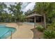 Poolside cabana featuring open-air seating, a fireplace, and access to community playground at 3025 Buckeley Cir, Charleston, SC 29414
