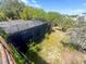 Exterior view of a concrete structure with lush greenery at 3030 Brownell, Sullivans Island, SC 29482