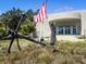 View of a structure with an anchor and flag in front at 3030 Brownell, Sullivans Island, SC 29482
