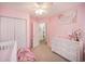Bright Bedroom with closet and white dresser, and a pink color scheme at 3050 Brigham Ct, North Charleston, SC 29406