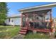 Cozy screened porch with wooden floors and comfortable seating, perfect for outdoor relaxation at 3050 Brigham Ct, North Charleston, SC 29406