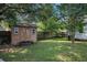 Outdoor shed in backyard providing additional storage space for tools and equipment at 3050 Brigham Ct, North Charleston, SC 29406