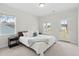 Bedroom with a king size bed, natural light, and access to the backyard at 307 Theus Pl, Huger, SC 29450