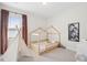 Neutral bedroom with carpet, light wood bed and a play tent at 307 Theus Pl, Huger, SC 29450