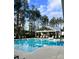 Sparkling community pool with lounge chairs and scenic views, perfect for relaxation at 307 Theus Pl, Huger, SC 29450