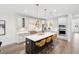 Modern kitchen featuring an island with seating, stainless steel appliances, and pendant lighting at 307 Theus Pl, Huger, SC 29450