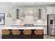 Stylish kitchen with white cabinets, stainless steel appliances, and quartz countertops at 307 Theus Pl, Huger, SC 29450