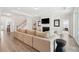 Spacious living room featuring a fireplace, staircase and neutral color palette at 307 Theus Pl, Huger, SC 29450