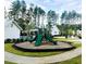 Community playground with slides and nearby pool in a beautiful, serene setting at 307 Theus Pl, Huger, SC 29450