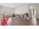 Spacious playroom with hardwood floors, a large window, and a variety of toys and play structures at 307 Theus Pl, Huger, SC 29450