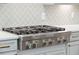 A stainless steel KitchenAid stove top with six burners is set into light gray cabinetry at 307 Theus Pl, Huger, SC 29450