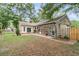 View of the brick and siding home with a walkway to the backyard and brick patio at 31 Monte Sano Dr, Hanahan, SC 29410