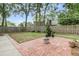 Brick patio area in the backyard with well-maintained grass and a wooden fence at 31 Monte Sano Dr, Hanahan, SC 29410