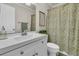 Well-lit bathroom featuring a modern vanity, patterned shower curtain, and a toilet at 31 Monte Sano Dr, Hanahan, SC 29410