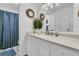 Bright bathroom with a modern sink, white cabinets, shiplap walls, and decorative accents at 31 Monte Sano Dr, Hanahan, SC 29410
