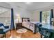 Comfortable bedroom with a baseball rug, desk, and chair next to windows with natural light at 31 Monte Sano Dr, Hanahan, SC 29410