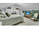 Cozy bedroom with sloped ceilings, carpeted floors, built-in desk, and seating area with TV at 31 Monte Sano Dr, Hanahan, SC 29410