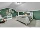 Inviting bedroom with green walls, light-colored carpet, and a comfortable bed with accent pillows at 31 Monte Sano Dr, Hanahan, SC 29410