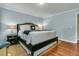 Serene bedroom featuring a plush bed, hardwood floors, accent pillows, and side tables with lamps at 31 Monte Sano Dr, Hanahan, SC 29410