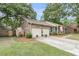 Charming brick home featuring a two-car garage, and landscaped front yard at 31 Monte Sano Dr, Hanahan, SC 29410