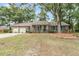 Inviting brick house featuring a manicured lawn and charming blue shutters at 31 Monte Sano Dr, Hanahan, SC 29410