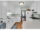 Well-lit kitchen with white cabinets, white countertops, and hardwood flooring at 31 Monte Sano Dr, Hanahan, SC 29410