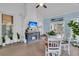 Sunroom featuring a brick fireplace, tv, brick floors and lots of plants at 31 Monte Sano Dr, Hanahan, SC 29410
