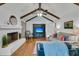 Comfortable living room featuring a white brick fireplace, vaulted ceiling, and hardwood flooring at 31 Monte Sano Dr, Hanahan, SC 29410