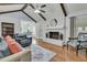 Inviting living room with vaulted ceiling, wood beams, brick fireplace, and hardwood floors at 31 Monte Sano Dr, Hanahan, SC 29410