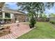 Picture of brick patio with beautiful plantings in the backyard and ample space for outdoor seating at 31 Monte Sano Dr, Hanahan, SC 29410