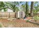 Backyard shed area with brick borders, a storage shed, and mature shade trees at 31 Monte Sano Dr, Hanahan, SC 29410