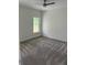 This bedroom has neutral carpeting, fresh paint, and ample natural light at 3214 Pinewood Dr, Ladson, SC 29456