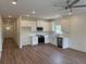 Bright kitchen features stainless appliances, white cabinetry, and hardwood flooring at 3214 Pinewood Dr, Ladson, SC 29456