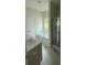 Bright bathroom with a soaking tub, shower, double sink vanity, and neutral decor at 3218 Pinewood Dr, Ladson, SC 29456