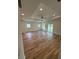 Large living room featuring wood-look floors, recessed lights, and sliding glass doors to the outdoors at 3218 Pinewood Dr, Ladson, SC 29456