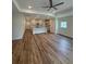 Bright living room with wood-look flooring open to the kitchen and featuring recessed lighting at 3218 Pinewood Dr, Ladson, SC 29456