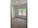 Cozy bedroom featuring neutral carpeting and a large window offering natural light at 3222 Pinewood Dr, Ladson, SC 29456