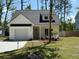 Charming single-Gathering home features a one-car garage and landscaped front yard at 3222 Pinewood Dr, Ladson, SC 29456