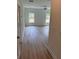 Bright living room with lots of light, ceiling fan, and gorgeous wood-look flooring at 3222 Pinewood Dr, Ladson, SC 29456